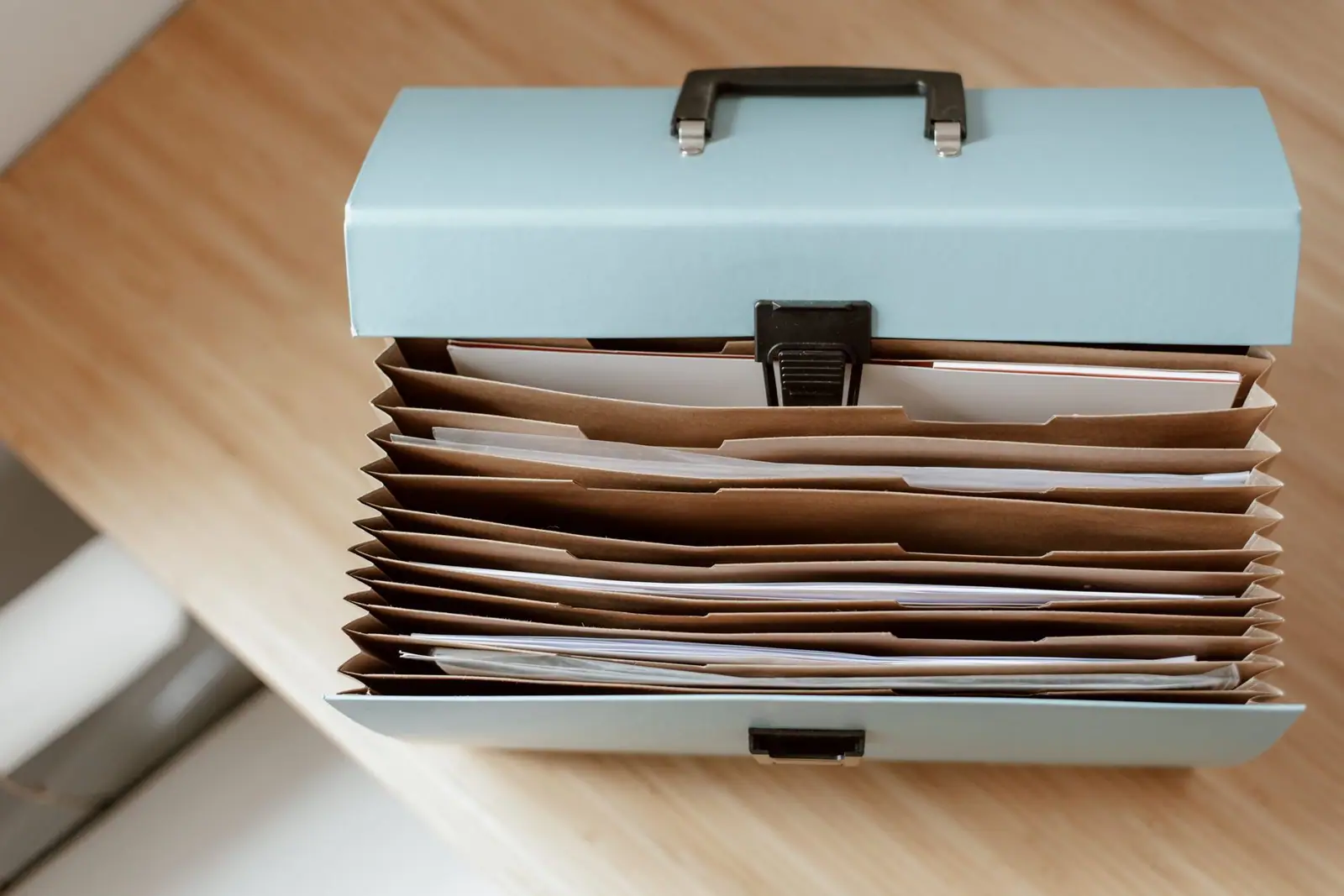 A document organiser box with labelled dividers