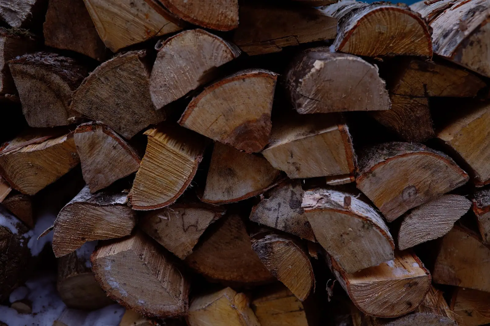 Close-up of stacked split firewood