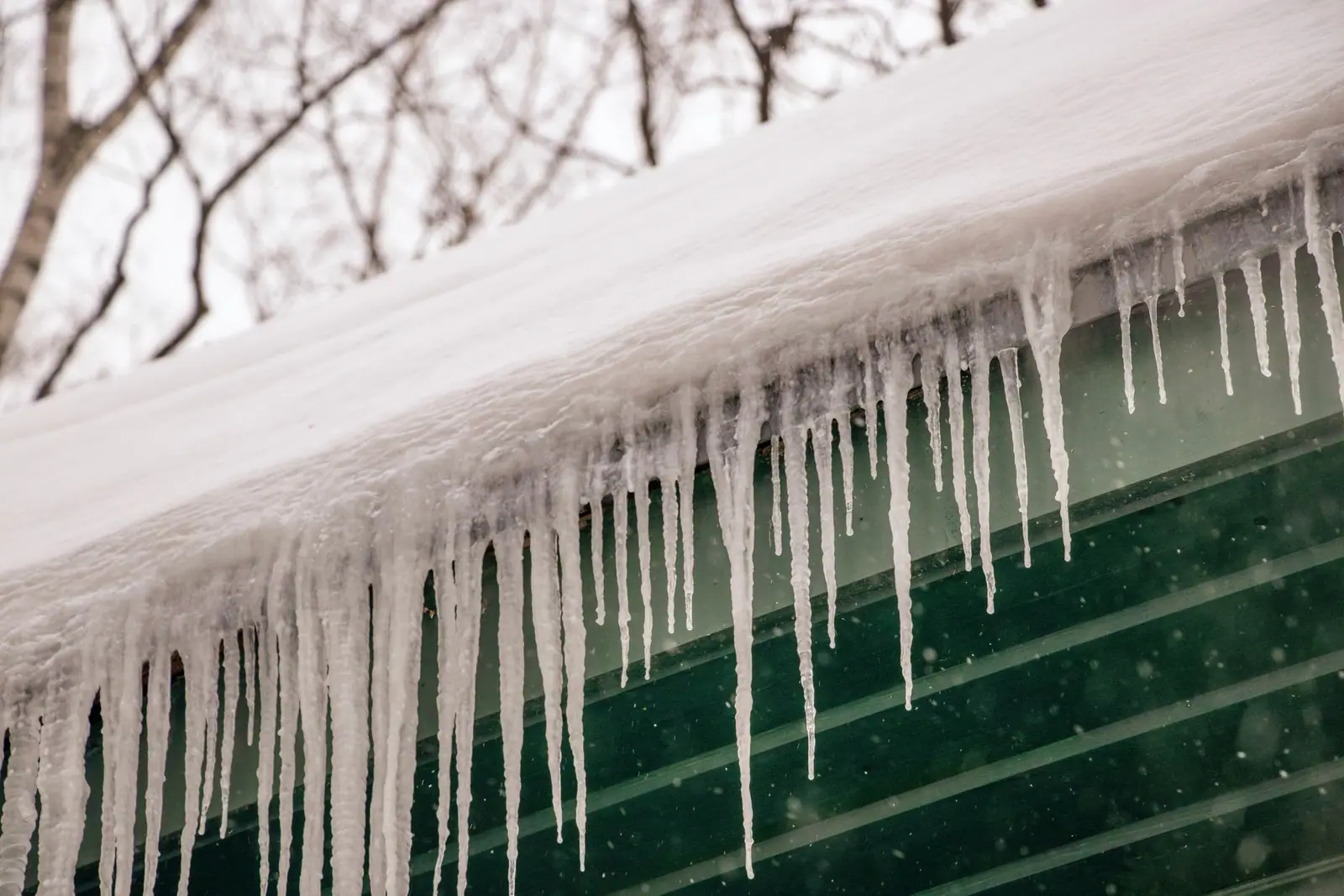 Icicles hanging from the gutter of a house